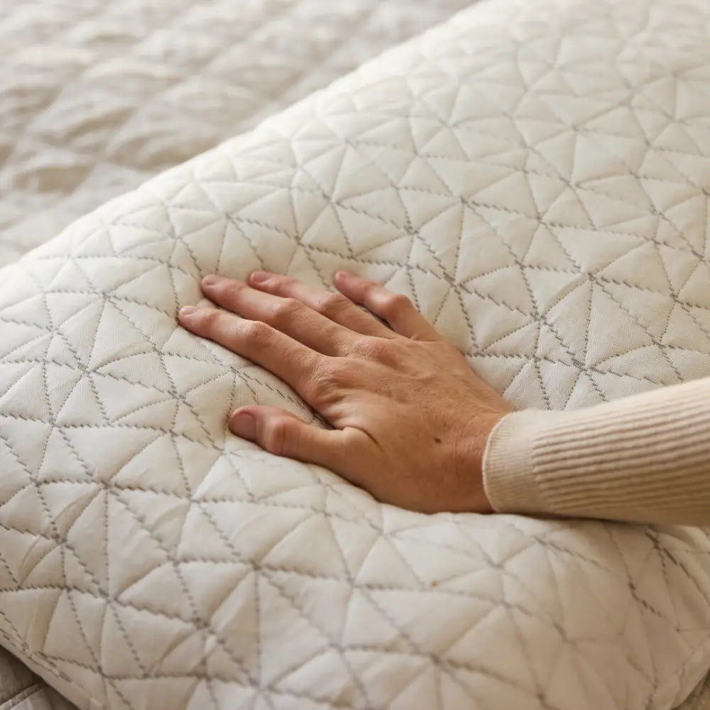 Side view of Nuzzie Cloud pillow showing plush shredded memory foam and microfiber fill