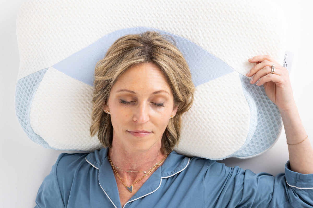 Back sleeper resting comfortably with ergonomic neck support on Sleep Again cervical pillow