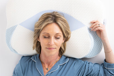 Back sleeper resting comfortably with ergonomic neck support on Sleep Again cervical pillow