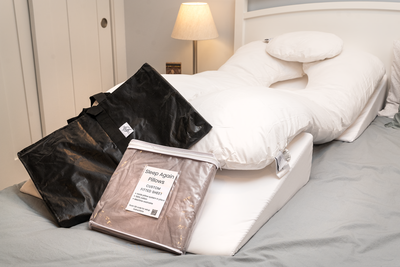Sleep Again Pillow System bundle shown with custom fitted sheet securing foam wedges