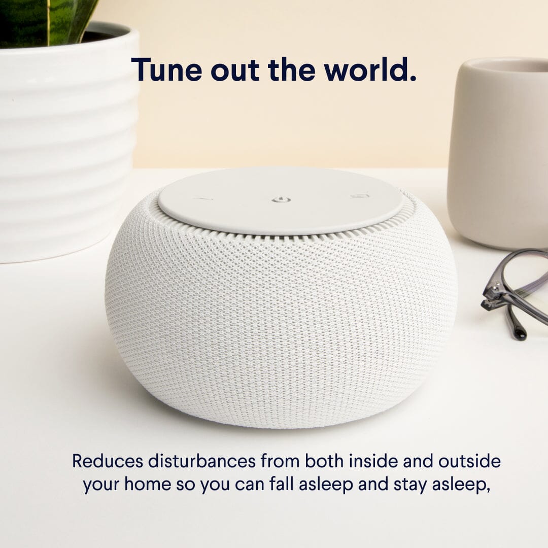 SNOOZ Pro : White Noise Sound Machine in white on a surface with text promoting its ability to reduce disturbances.