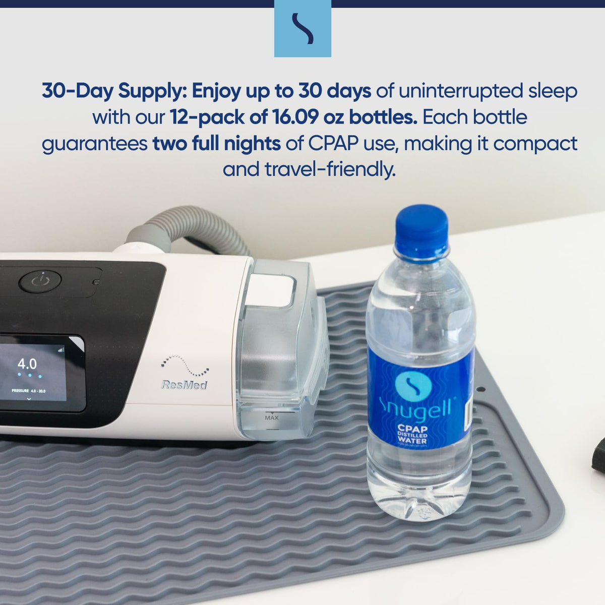 CPAP machine with a bottle of Snugell CPAP water on a white surface