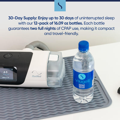 CPAP machine with a bottle of Snugell CPAP water on a white surface