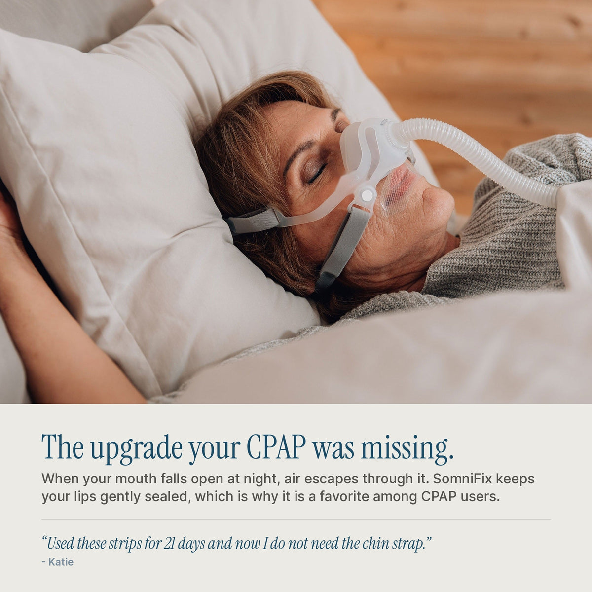 A woman lying in bed wearing a SomniFix CPAP mask and tube, with text below advertising an upgrade for missing CPAP strips.
