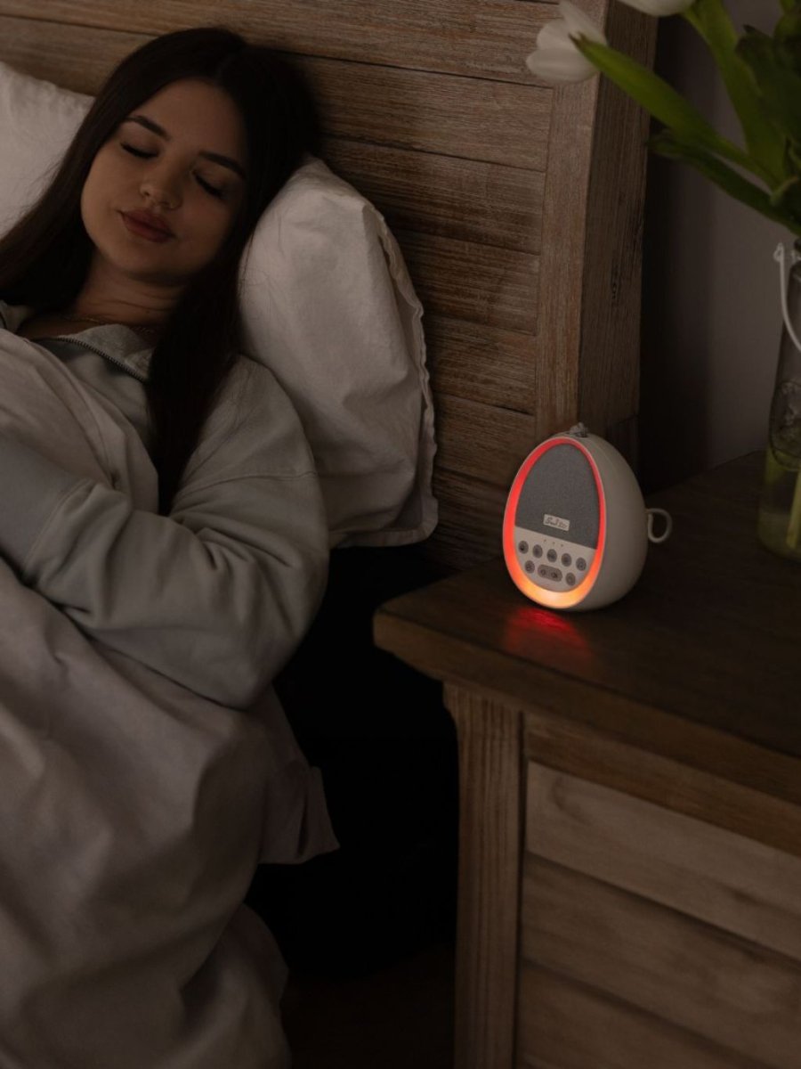 Sweet Zzz's White Noise Machine - on nightstand and lady sleeping