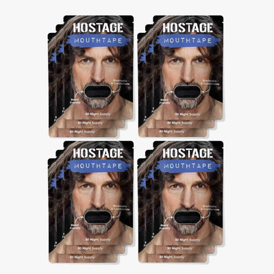 Twelve-pack full one-year supply bundle of black Hostage Mouth Tape boxes