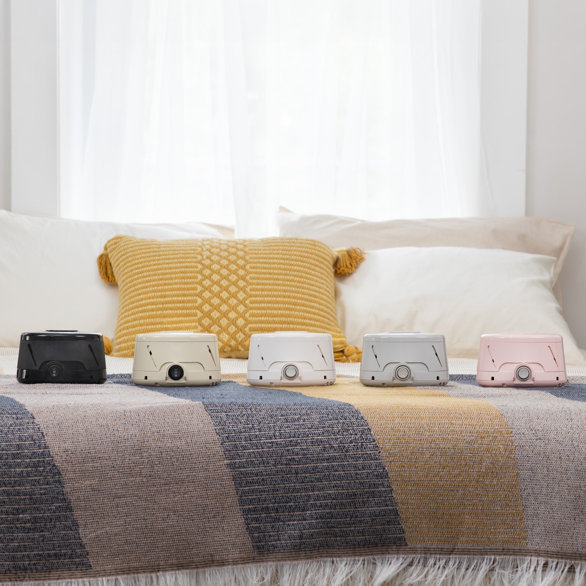 Yogasleep Dohm acoustic sound machine family showcasing the original Dohm Classic