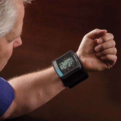 HealthSmart Standard digital wrist blood pressure monitor worn on wrist during measurement