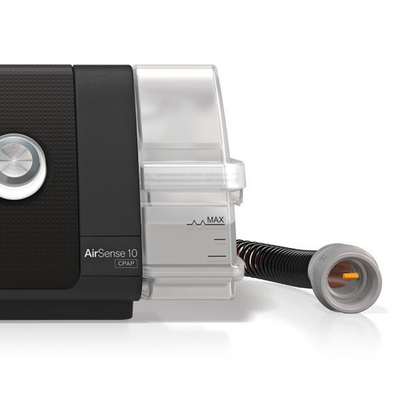 Side angle view of refurbished ResMed AirSense 10 AutoSet CPAP machine and water chamber tub