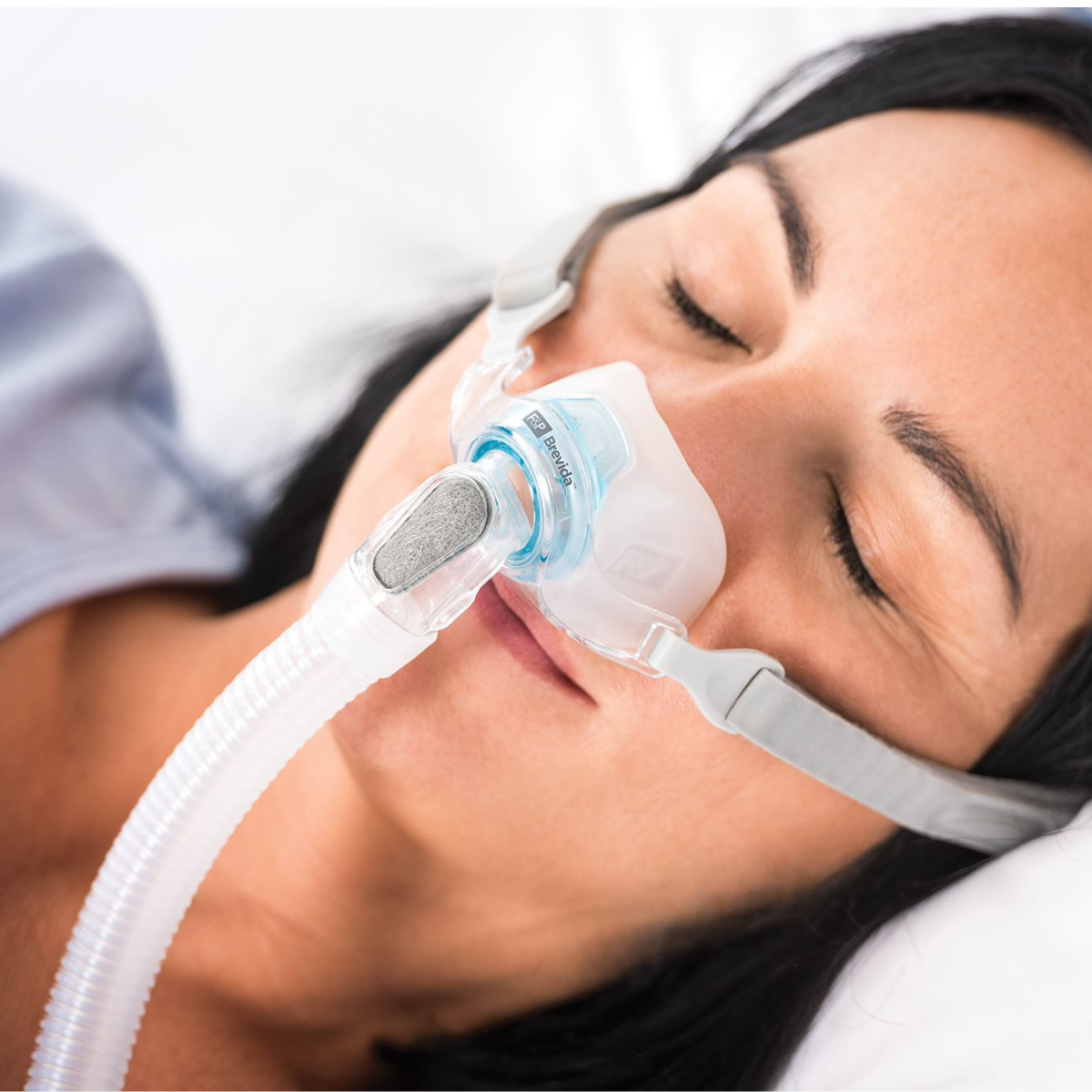 Woman Sleeping with a Fisher & Paykel Brevida AirPillow Mask Cushion